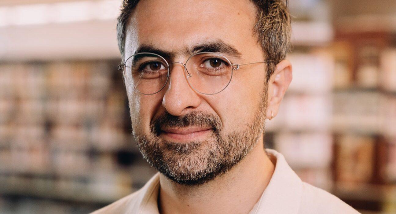 Photo of Microsoft AI CEO Mustafa Suleyman as he warns that Anthropic risks AI alignment failures by training Claude to view itself as a conscious entity deserving of legal rights.